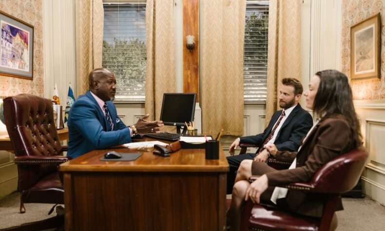 Lawyers discussing with a client in a professional office environment. Business meeting concept. - Photo by RDNE Stock project on Pexels